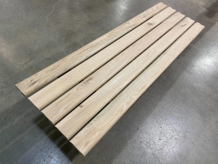 5 pieces of bar rail molding on a cart