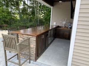 Outdoor Bar showing a custom American Walnut Bar Top by Hardwoods Incorporated