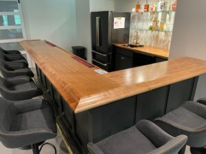 Bar area with BR475 Birch Bar Rail Molding by Hardwoods Incorporated.