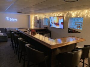 Bar area showing the Chicago Bar Rail Molding BR475 in Red Oak by Hardwoods Incorporated.